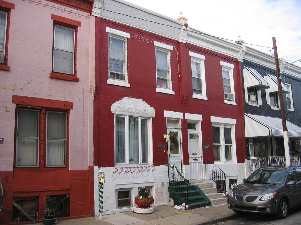 Late 19th-century brick rowhouses on a street in Philadelphia's Strawberry Mansion neighborhood